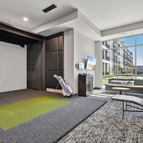 Golf simulator in carpeted room